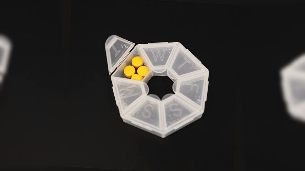 transparent weekly braille pill box with raised day-letter lids