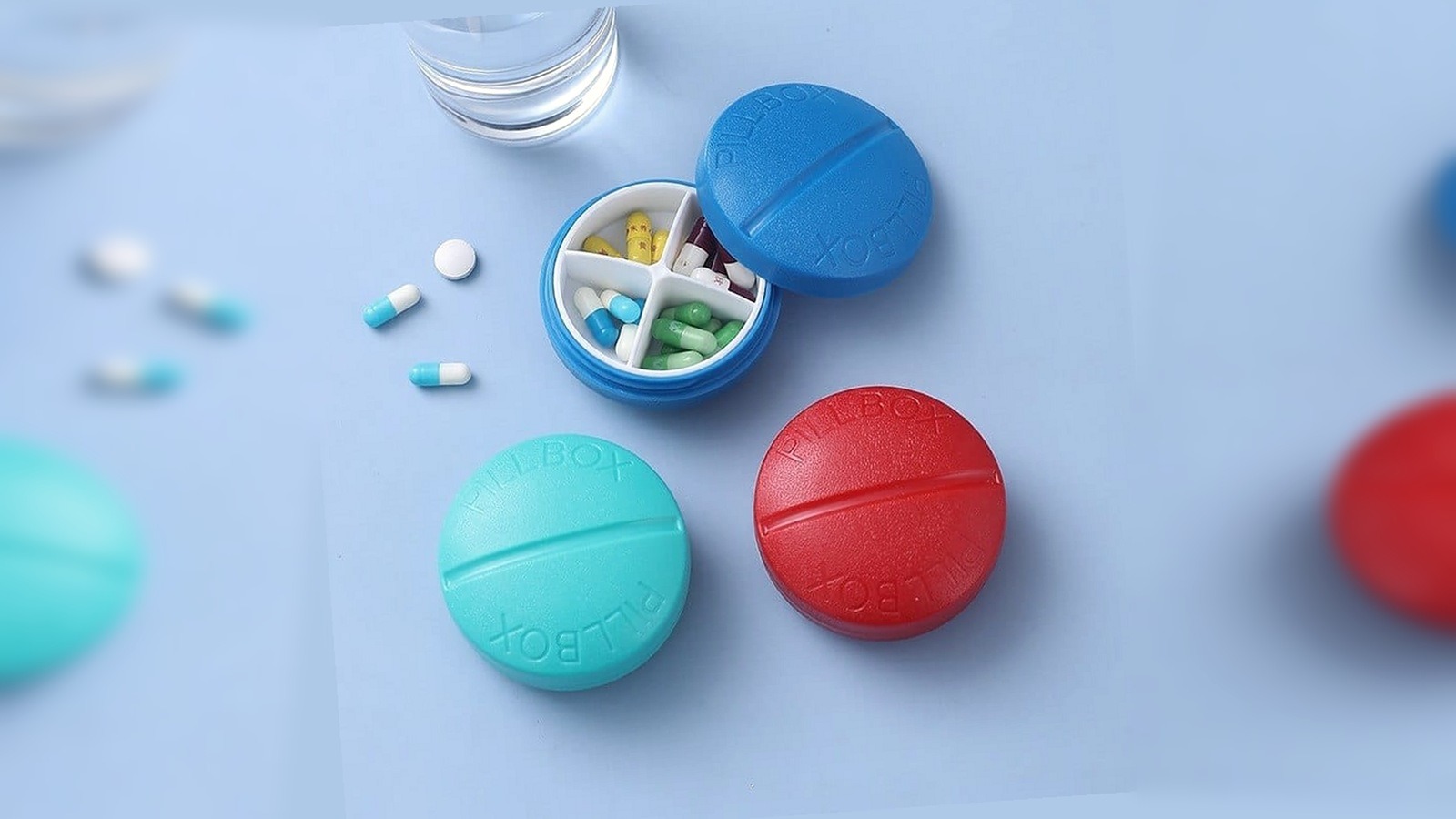 pocket pill box in four colours with the lid open